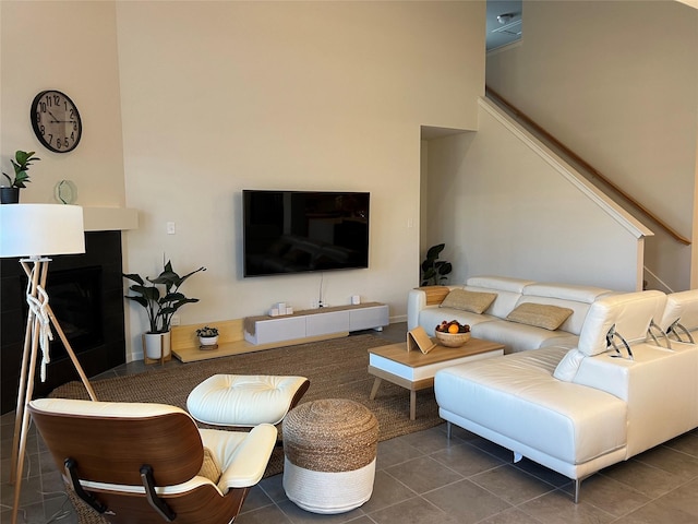 living room featuring dark tile patterned flooring