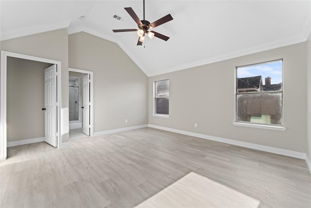 unfurnished bedroom featuring ensuite bathroom, light hardwood / wood-style floors, lofted ceiling, ceiling fan, and ornamental molding