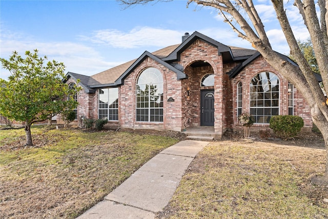 view of front of property with a front lawn