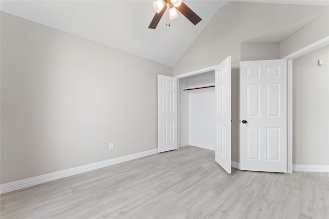 unfurnished bedroom featuring ceiling fan, light hardwood / wood-style floors, a closet, and lofted ceiling