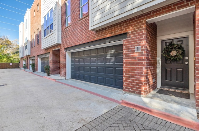 view of exterior entry featuring a garage