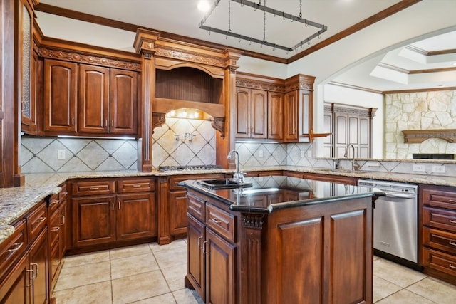 kitchen featuring stainless steel dishwasher, ornamental molding, a center island with sink, and sink