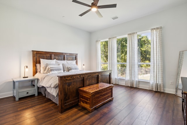 bedroom with ceiling fan and dark wood-type flooring