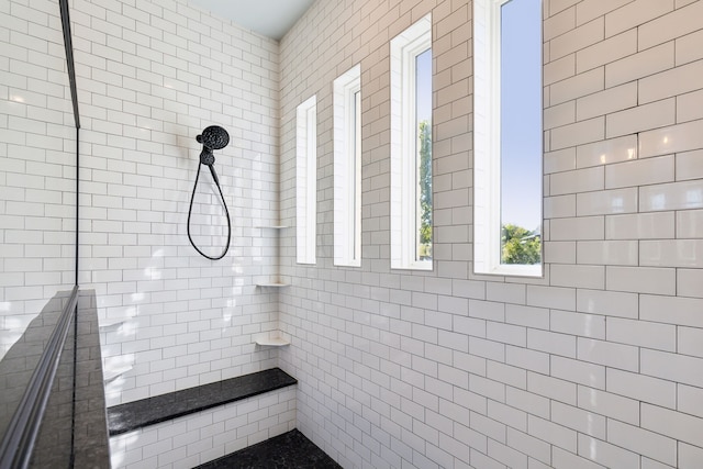 bathroom with tiled shower