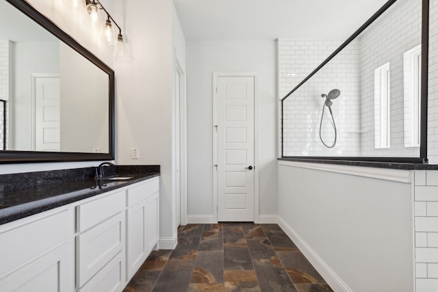 bathroom with a shower and vanity