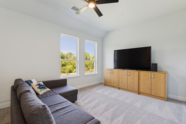 carpeted living room with lofted ceiling and ceiling fan