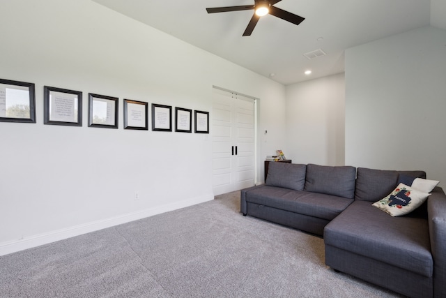 living room with ceiling fan and light colored carpet