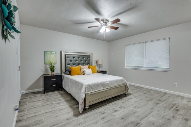 bedroom with ceiling fan and light hardwood / wood-style flooring