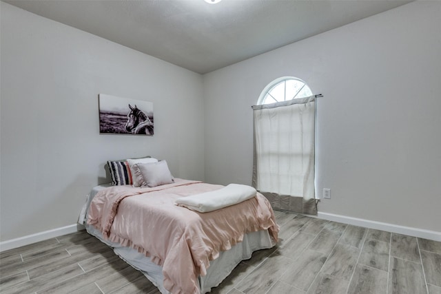 bedroom with light hardwood / wood-style flooring