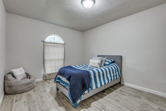 bedroom featuring hardwood / wood-style flooring