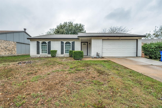 ranch-style house featuring a front lawn and a garage