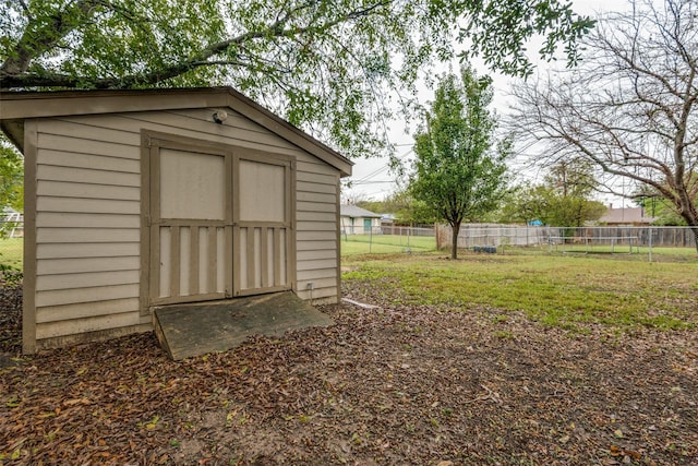 view of outbuilding featuring a yard