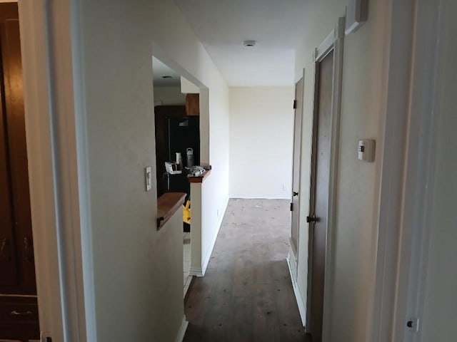 hallway featuring wood finished floors