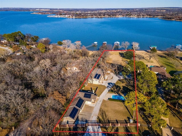 birds eye view of property with a water view