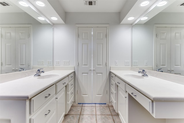 bathroom with vanity and tile patterned flooring