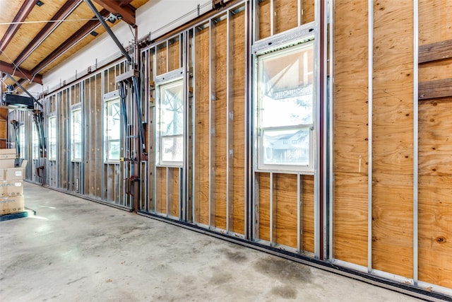 miscellaneous room featuring concrete flooring and a wealth of natural light