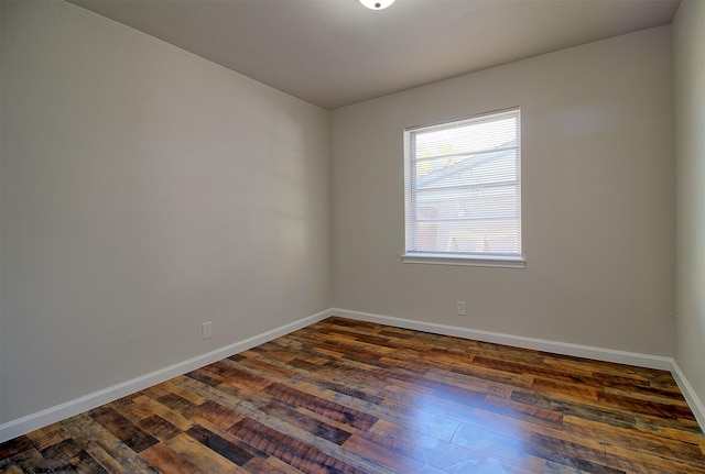 empty room with dark hardwood / wood-style floors