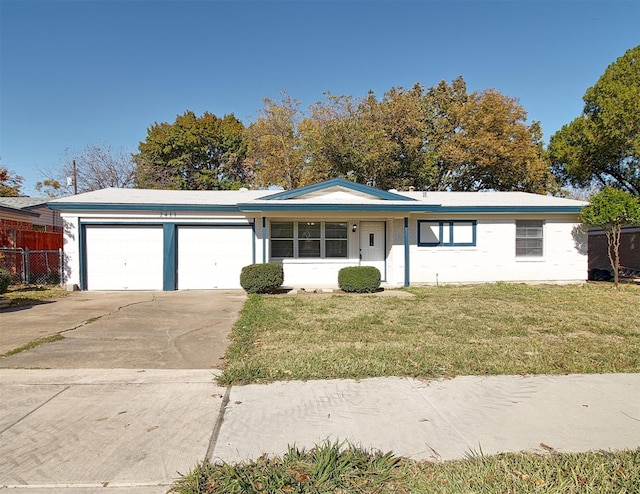 single story home with a garage and a front lawn