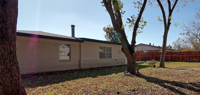 view of home's exterior featuring a yard