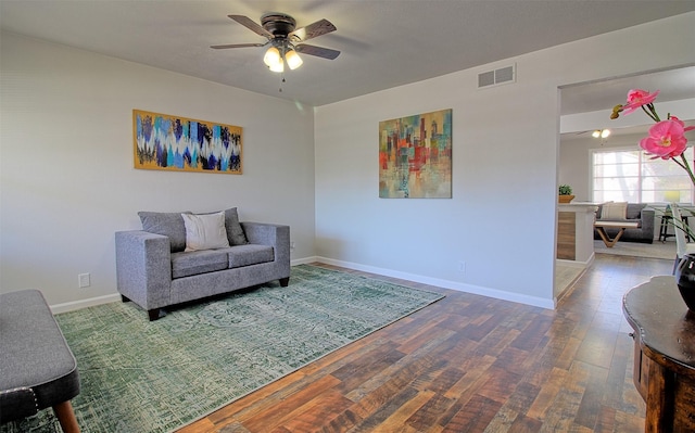 living room with ceiling fan and hardwood / wood-style floors