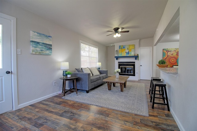 living room with vaulted ceiling, a fireplace, ceiling fan, and dark hardwood / wood-style floors