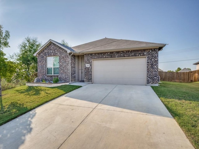 single story home featuring a front lawn and a garage