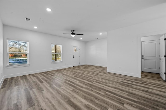 empty room featuring ceiling fan and light hardwood / wood-style flooring