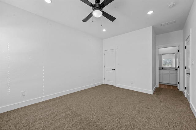 unfurnished bedroom with ceiling fan and carpet flooring