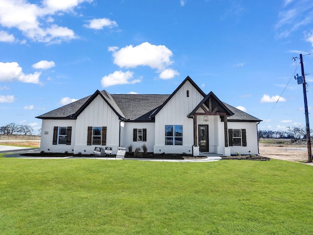 modern farmhouse featuring a front lawn