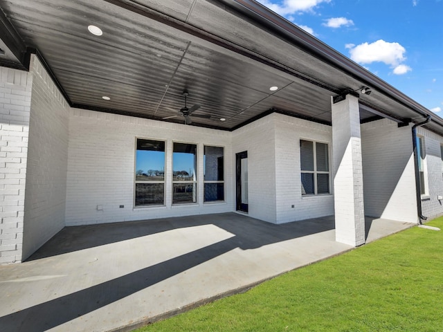 view of patio featuring ceiling fan