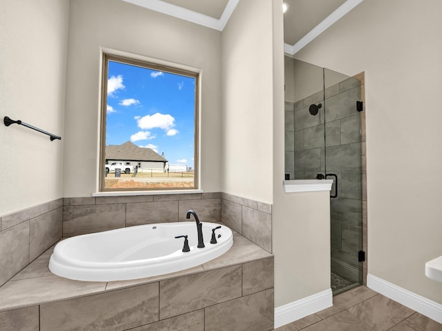 bathroom with ornamental molding, tile patterned floors, and independent shower and bath