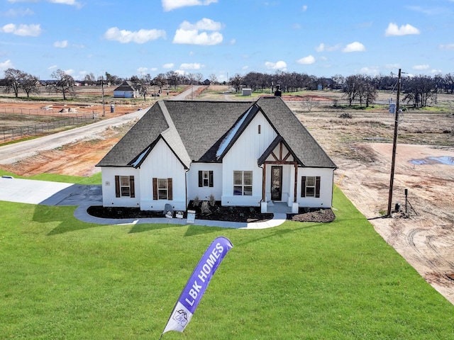 modern inspired farmhouse with a front yard