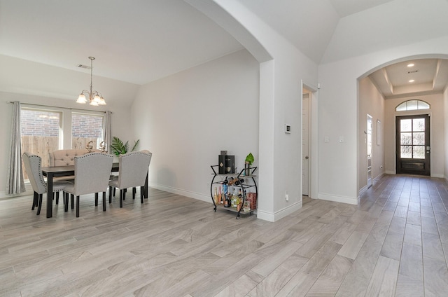 interior space featuring light hardwood / wood-style floors and a chandelier