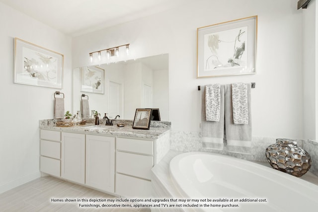 bathroom with tiled tub and vanity