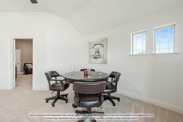 office area featuring lofted ceiling and light carpet