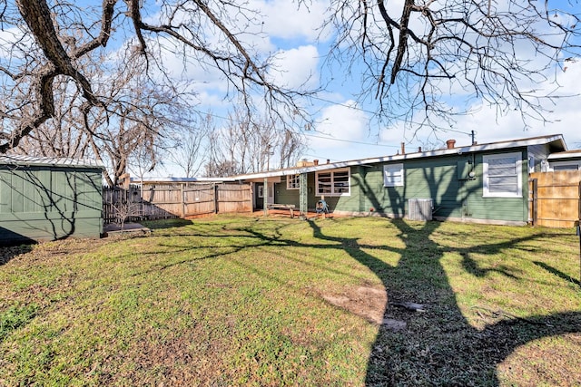 rear view of property with a lawn