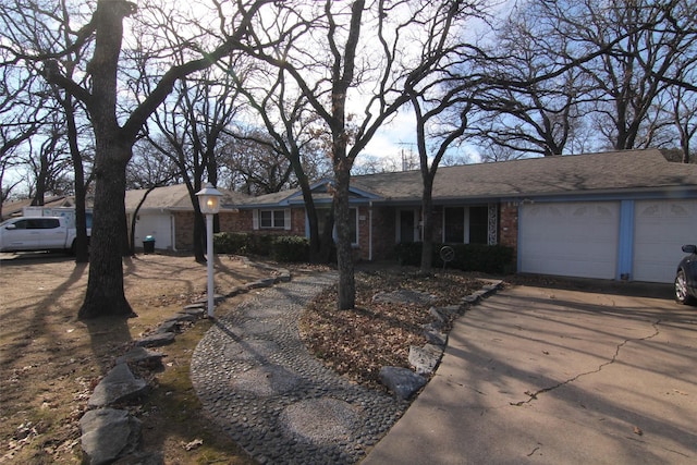 ranch-style house featuring a garage