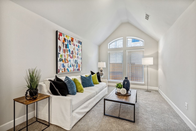 living room featuring vaulted ceiling and carpet floors