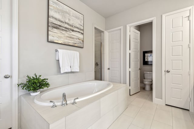 bathroom featuring toilet, plus walk in shower, and tile patterned floors