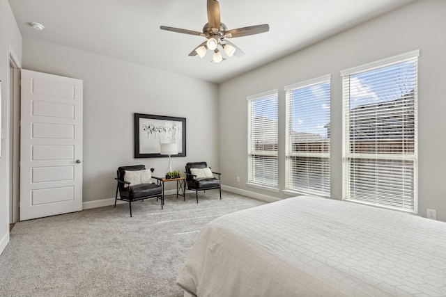 bedroom with ceiling fan and light carpet