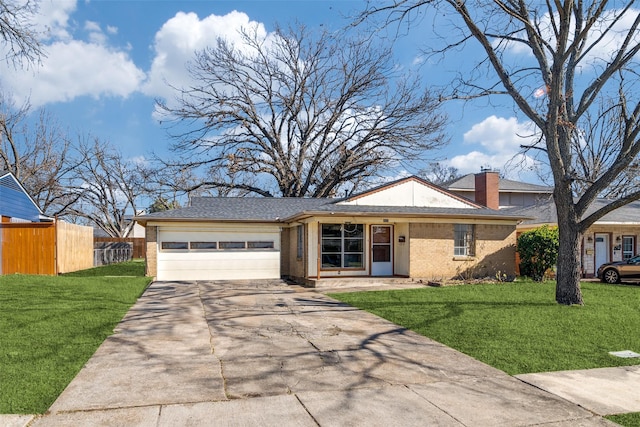 ranch-style house with a front lawn and a garage