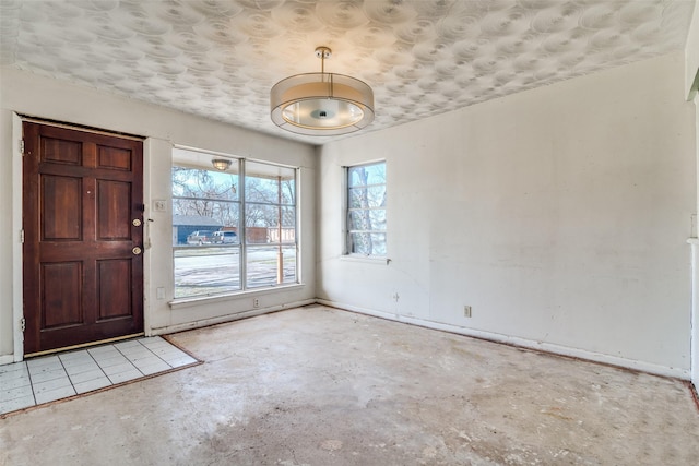 foyer featuring a textured ceiling