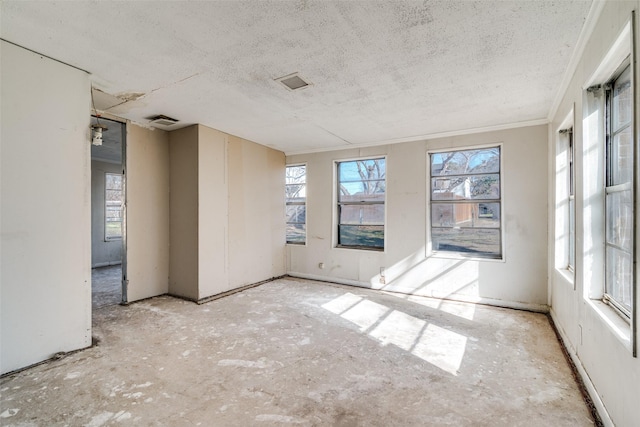 spare room featuring a textured ceiling