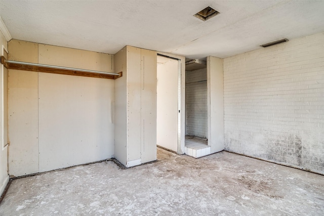 interior space featuring a textured ceiling