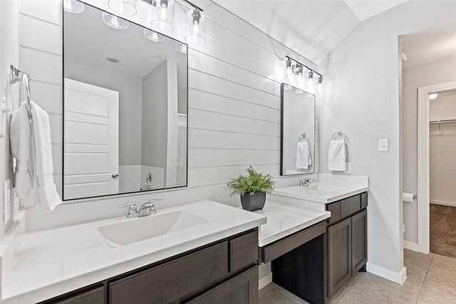 bathroom featuring tile patterned flooring and vanity