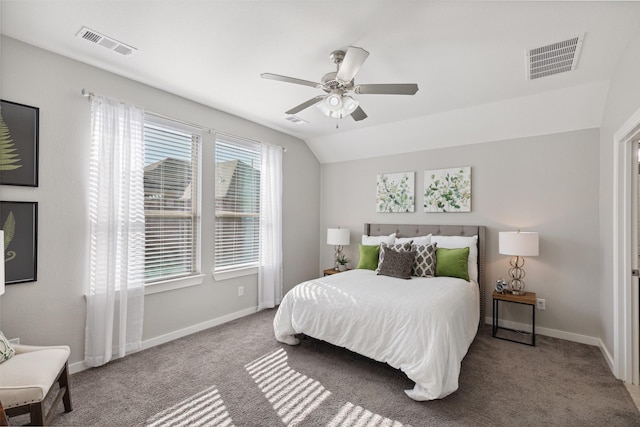 carpeted bedroom featuring ceiling fan and vaulted ceiling