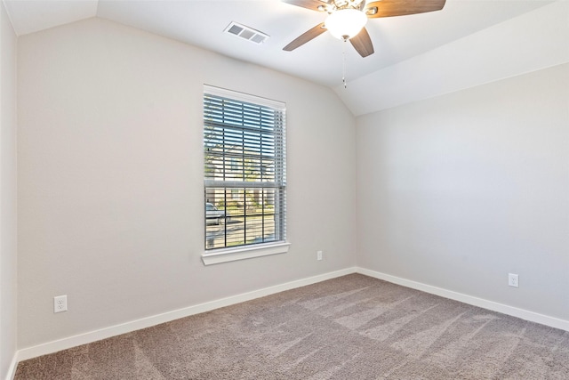 spare room with lofted ceiling, carpet floors, and ceiling fan