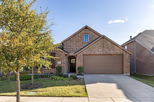 front of property featuring a garage and a front lawn