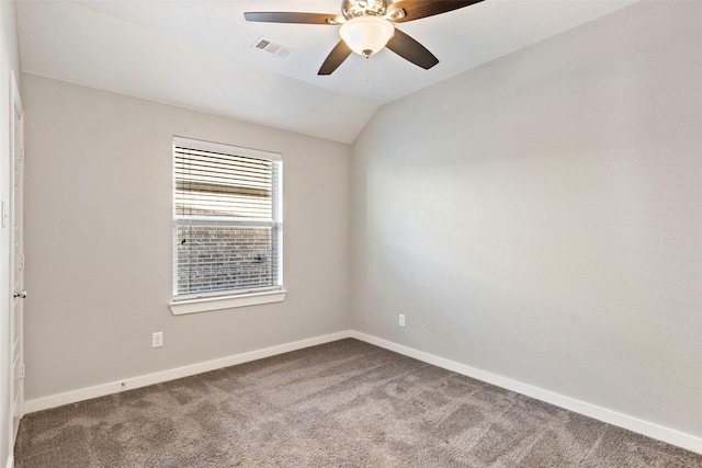 unfurnished room with carpet, ceiling fan, and vaulted ceiling