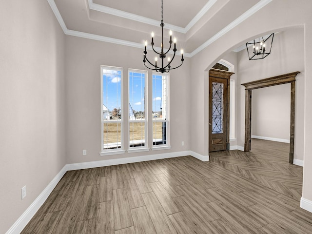 foyer entrance with hardwood / wood-style floors, a tray ceiling, and plenty of natural light